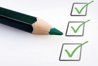 Grüner Stift zum Abhaken der Checkliste